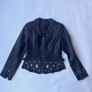 Black leather jacket with metal grommets and laced detail